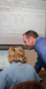 Neal Otto works with a student learning Excel Jumpstart owner and lead trainer Neal Otto works with a student on Excel training